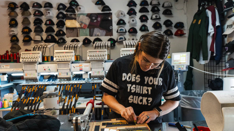 Embroidery wall and heat press finishing at 4Winners Merch