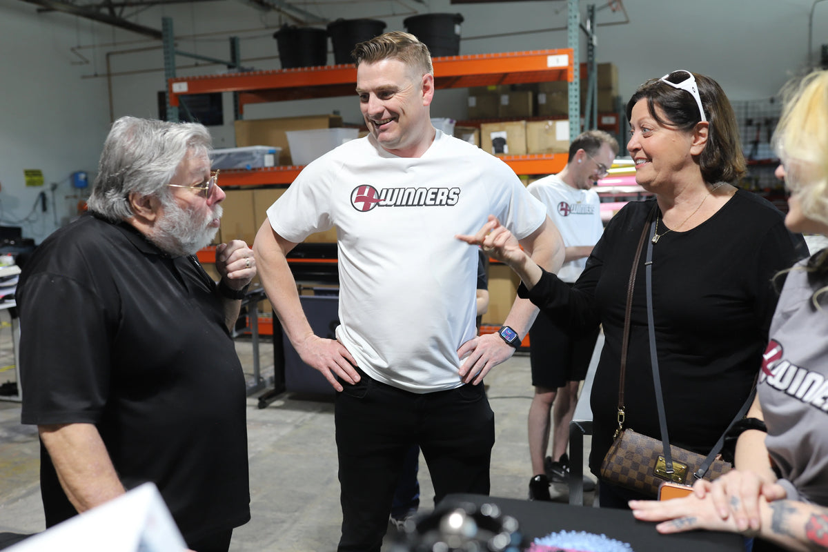 Group of people interacting in a warehouse setting